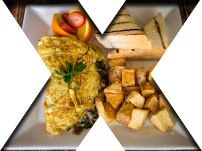 Cheese omelette with golden home fries, buttered toast, and fruit