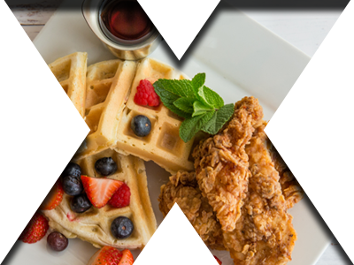 Fried chicken and waffles with homemade maple butter syrup, and fresh fruit