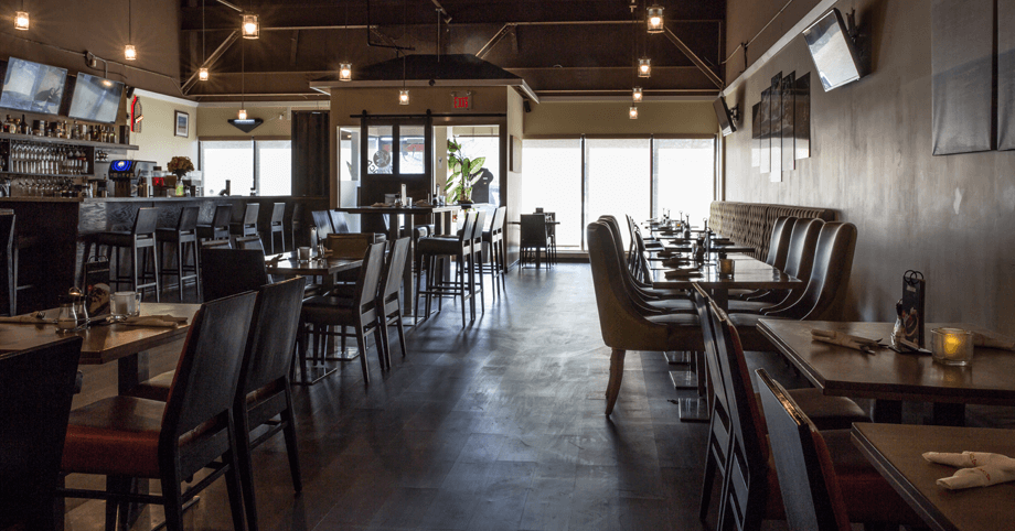 Xaymaca Restaurant interior with dimmed lights, offering a warm and inviting ambiance