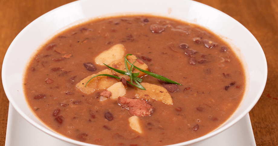 Hearty bowl of rich Jamaican red peas soup with tender salt beef and dumplings
