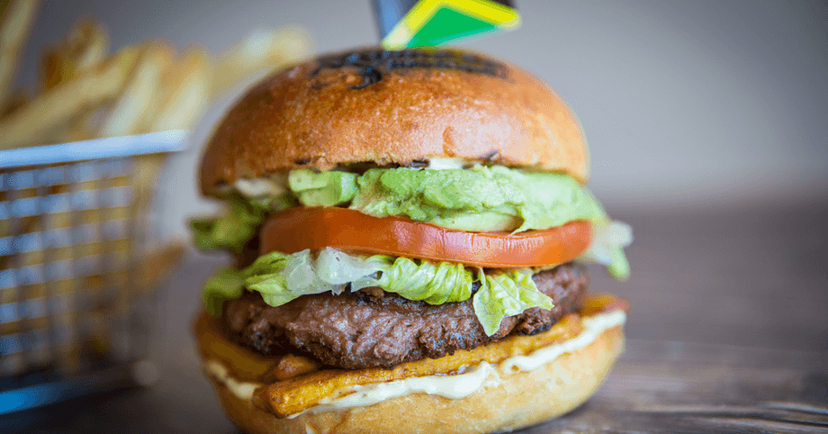 Rasta Veggie Burger – Beyond Meat patty with plantain, lettuce, tomato, avocado, and homemade vegan aioli