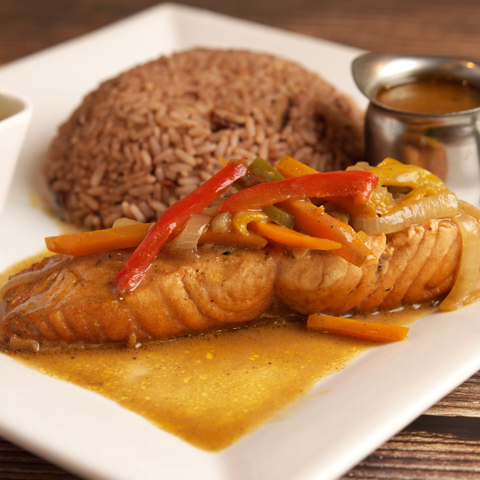 Brown stew salmon served with rice and peas – thumbnail view