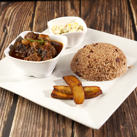 Oxtail with rice and peas, plantain, and macaroni salad – thumbnail view