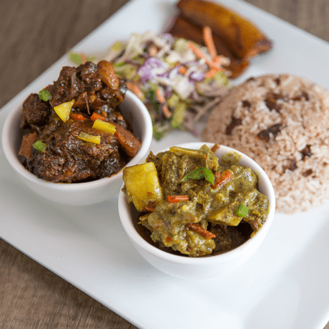 Oxtail and curry goat combo with rice & peas, plantain, and coleslaw – thumbnail view