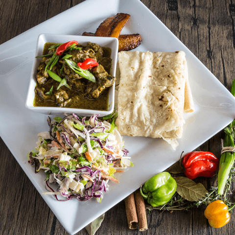 Curry goat with roti, plantain, and salad – thumbnail view